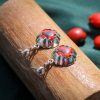 Aretes Amuleto Chacana de Huayruro en Plata 950