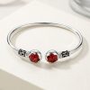 Brazalete Flor de Huayruro en Plata Ley 950 | Pulsera Rígida de Protección | Joyería Artesanal Peruana Premium